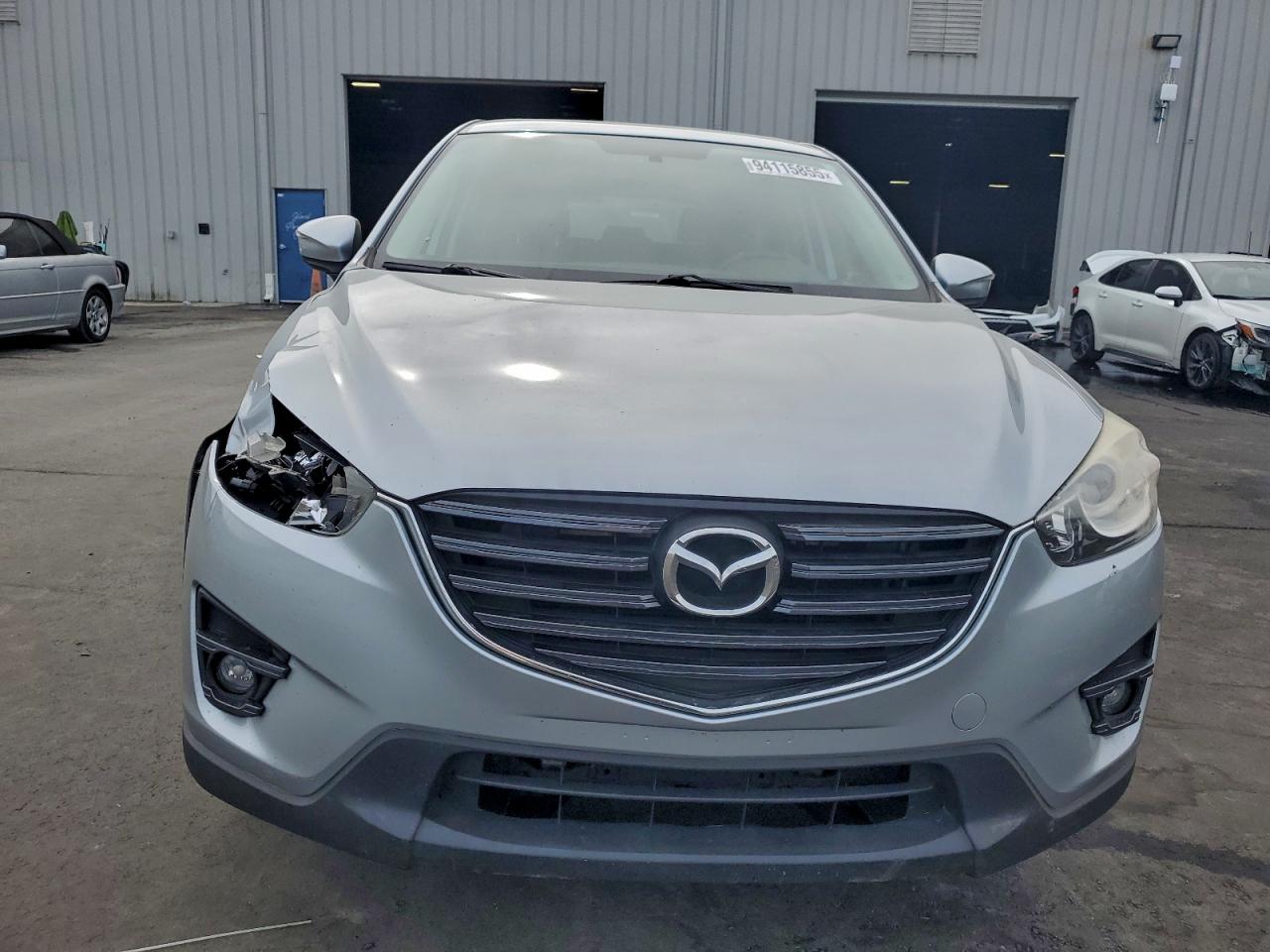 2016 Mazda Cx-5 Touring VIN: JM3KE4CY9G0606014 Lot: 94115855