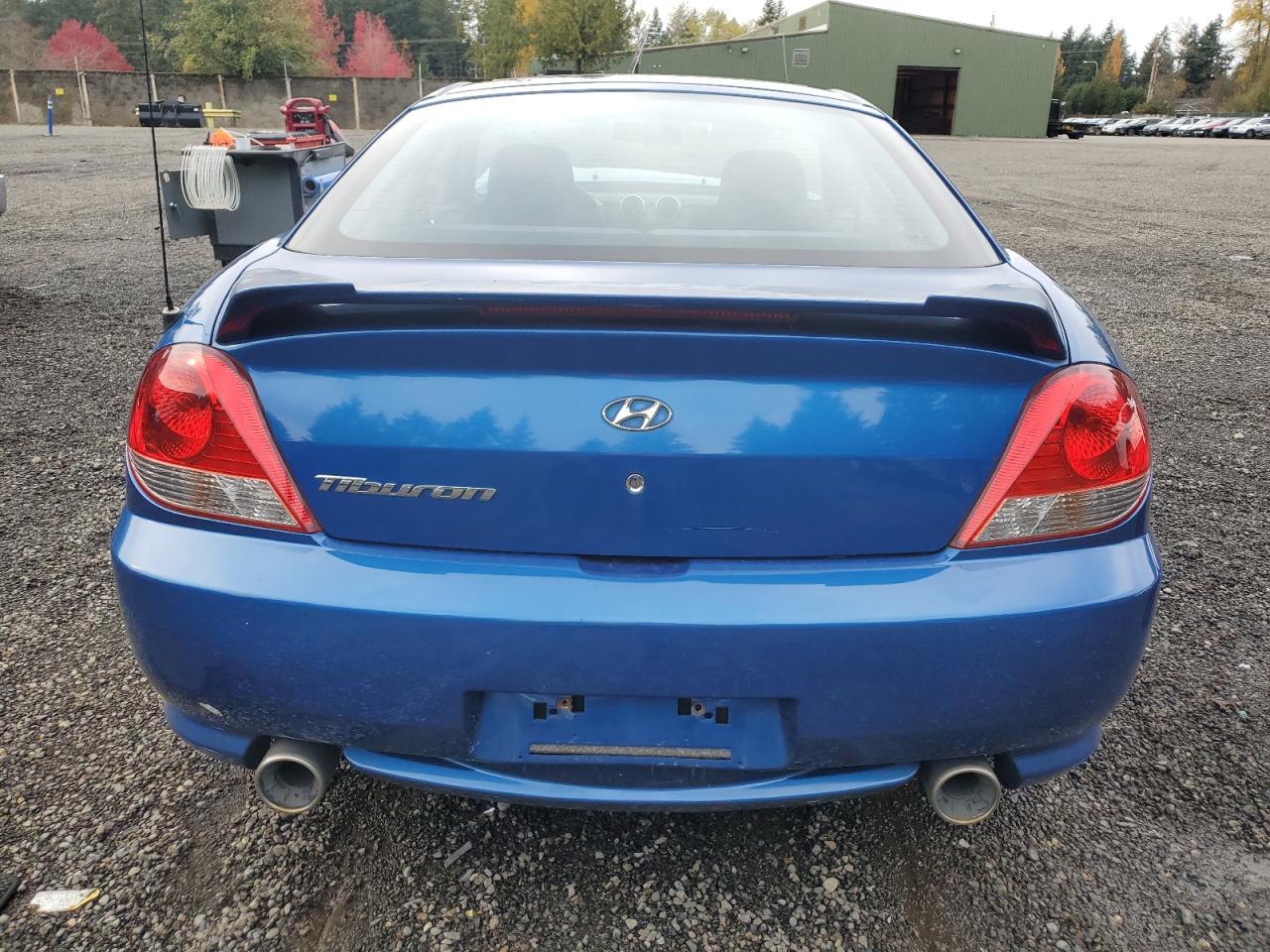 2005 Hyundai Tiburon VIN: KMHHM65DX5U168083 Lot: 91311075