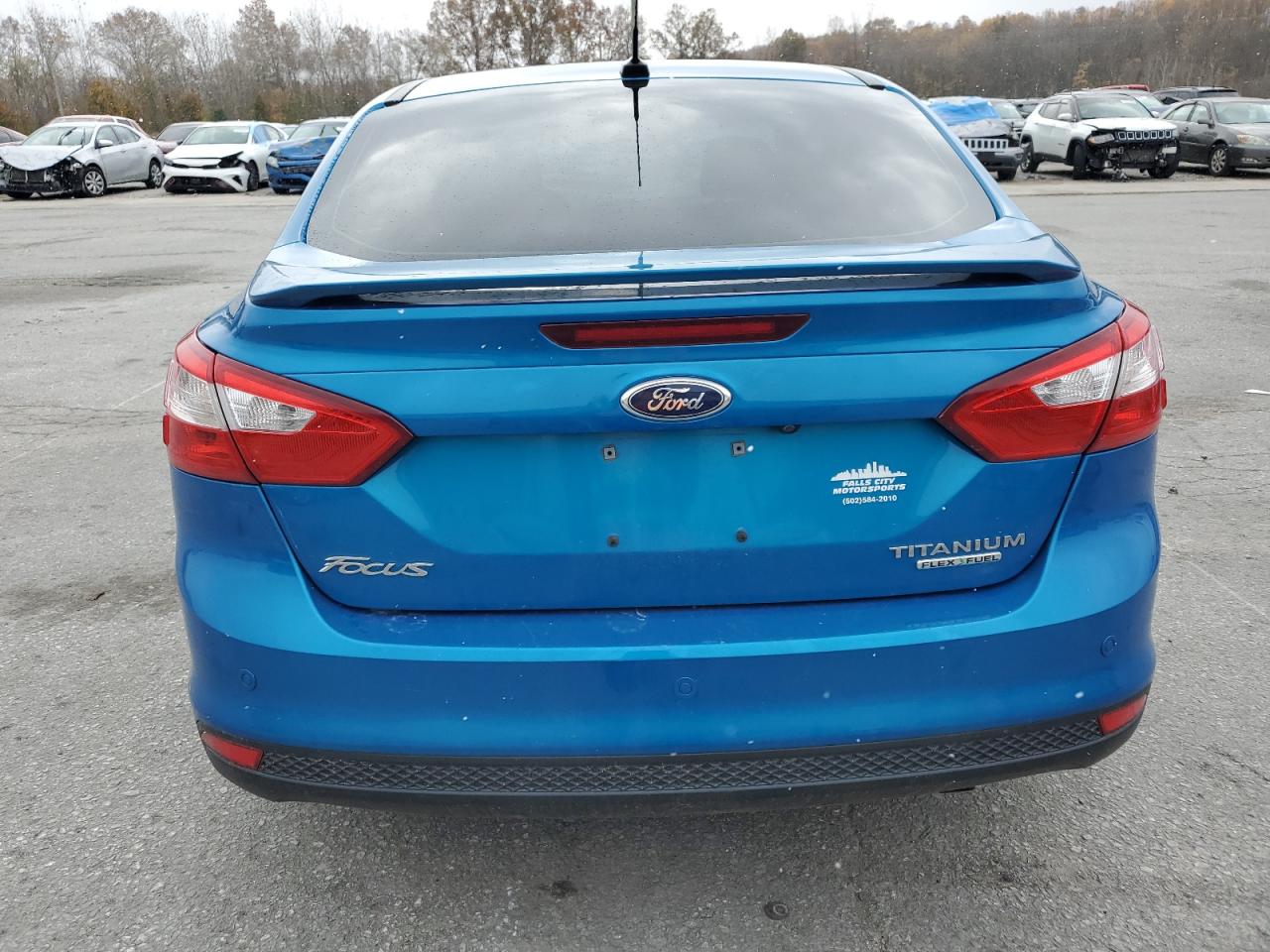 2014 Ford Focus Titanium VIN: 1FADP3J2XEL428703 Lot: 91910915