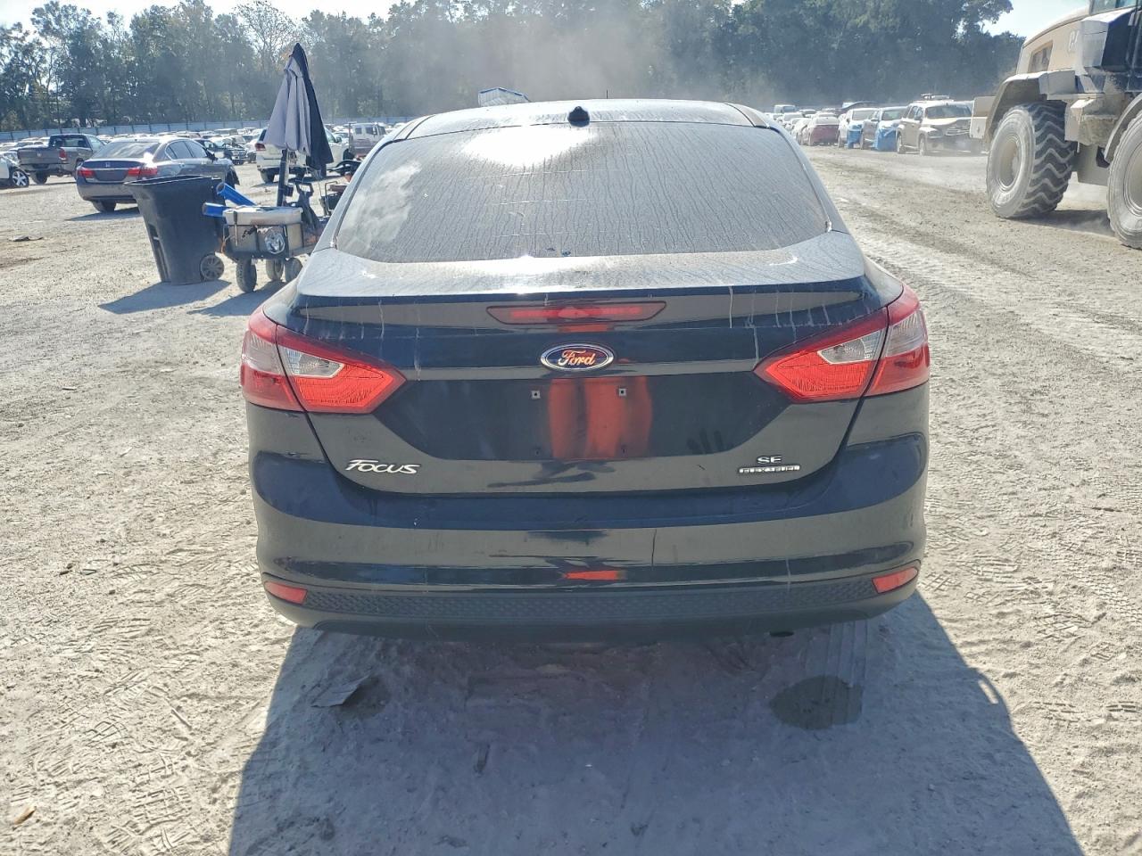 2014 Ford Focus Se VIN: 1FADP3F20EL165260 Lot: 94064565