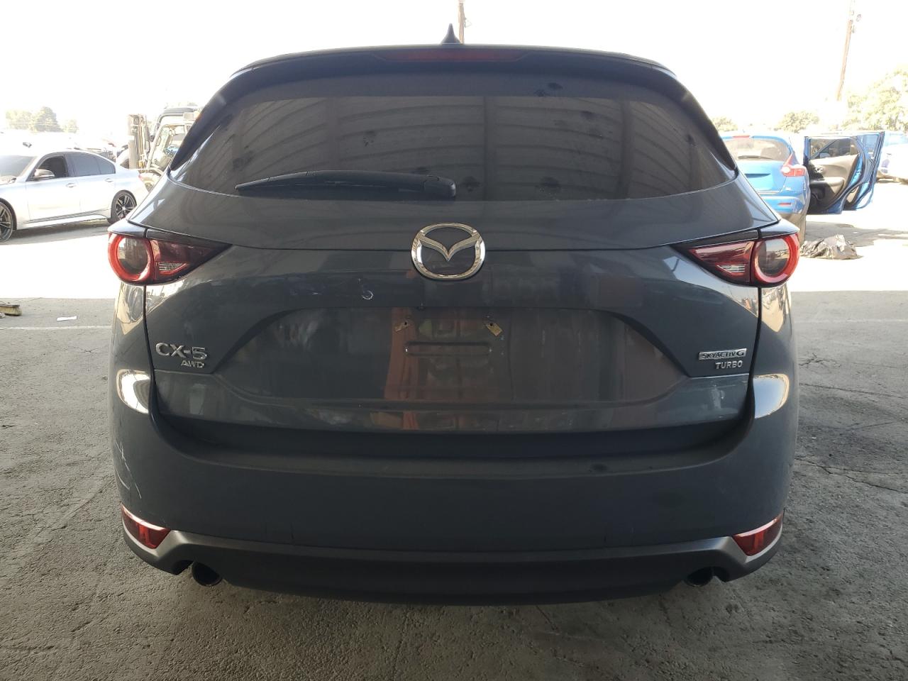 2021 Mazda Cx-5 Carbon Edition VIN: JM3KFBCY9M0402553 Lot: 91989735