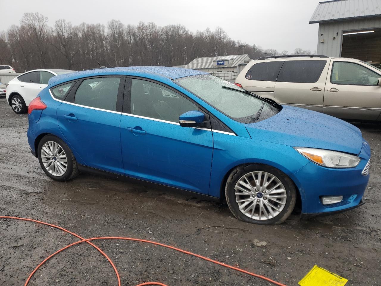 VIN 1FADP3N25FL254017 2015 FORD FOCUS no.4