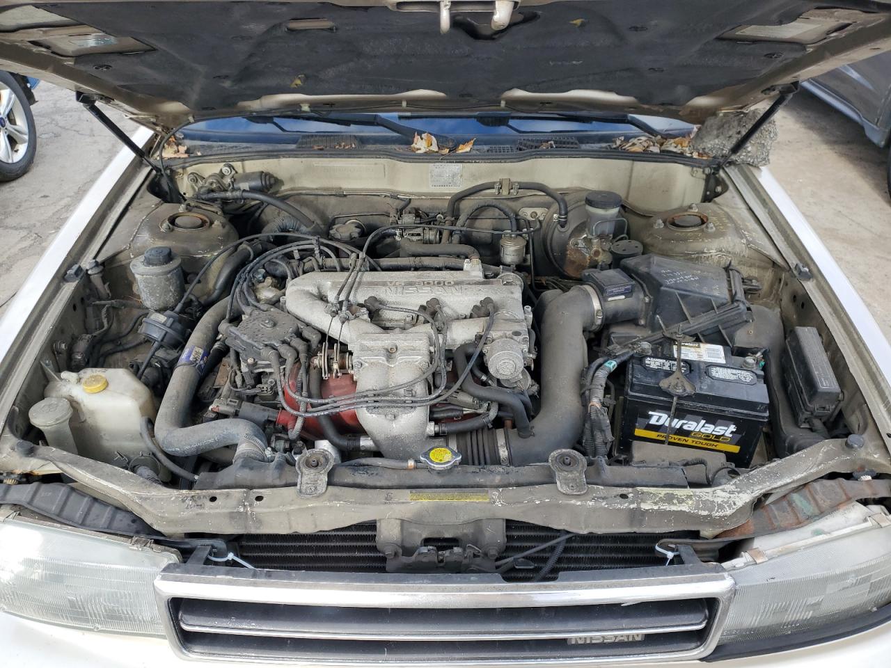 1990 Nissan Maxima VIN: JN1HJ01P8LT402950 Lot: 82714734