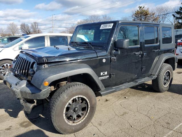 JEEP WRANGLER U 2009 black 4dr spor gas 1J4GA391X9L772701 photo #1