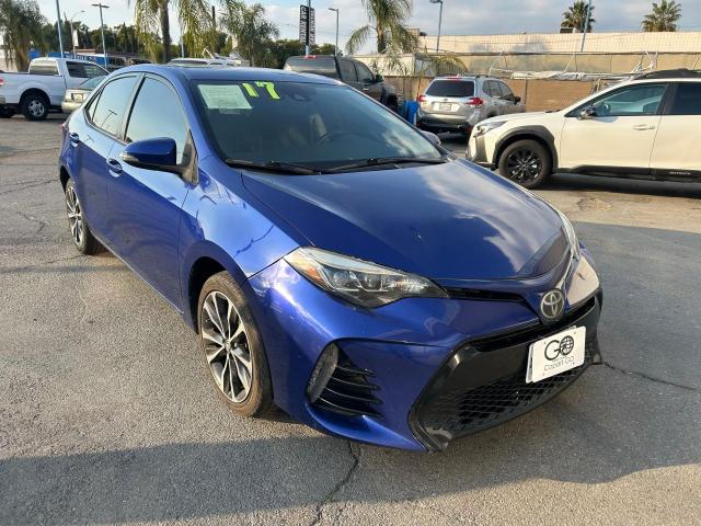 TOYOTA COROLLA L 2017 blue sedan 4d gas 5YFBURHE9HP707150 photo #1