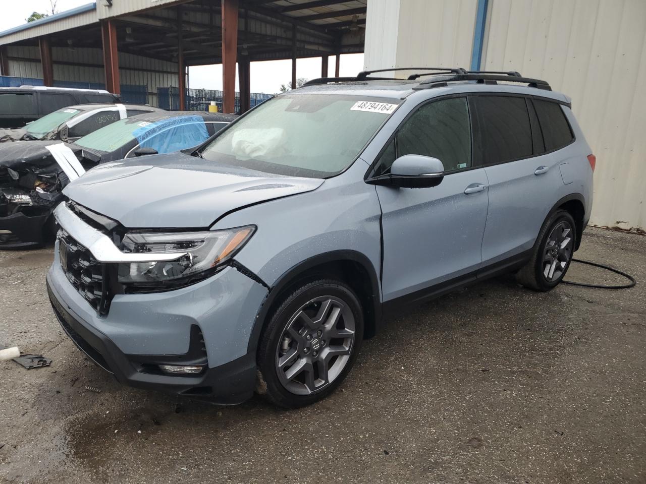 2022 Honda Passport Exl vin: 5FNYF7H5XNB000235