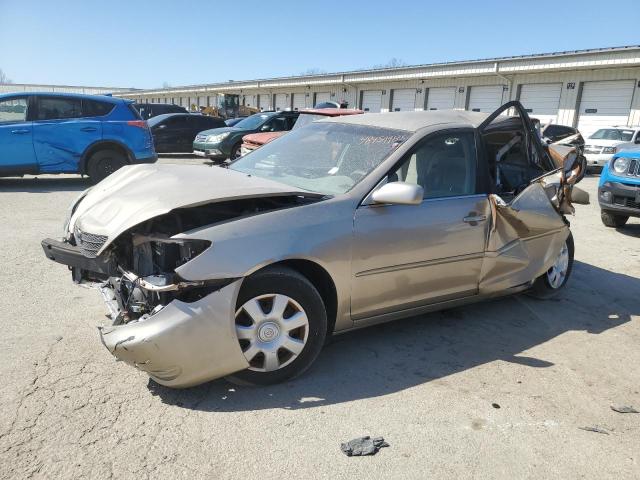 TOYOTA CAMRY LE 2002 tan sedan 4d gas JTDBE32K520076083 photo #1