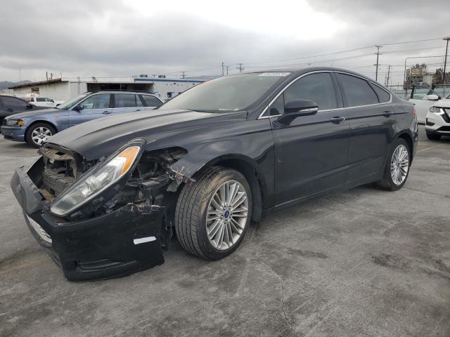 Lot #2461617328 2015 FORD FUSION SE salvage car