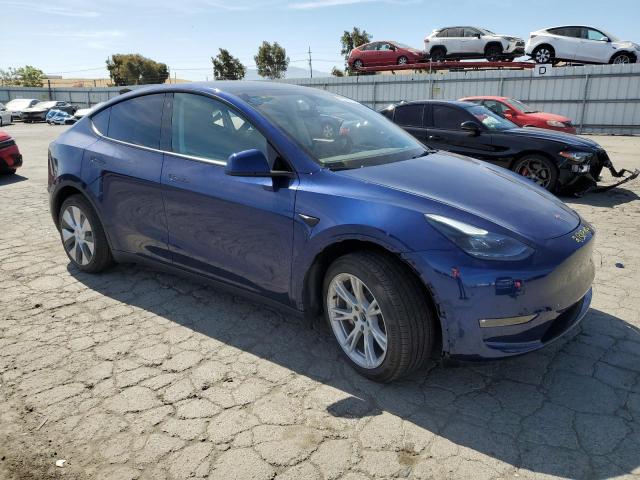 2023 Tesla Model Y VIN: 7SAYGDEE4PF704520 Lot: 56623784