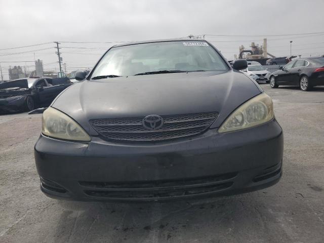 2002 Toyota Camry Le VIN: JTDBE32K320019347 Lot: 56772384