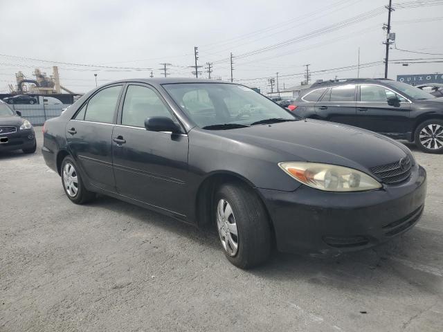 2002 Toyota Camry Le VIN: JTDBE32K320019347 Lot: 56772384