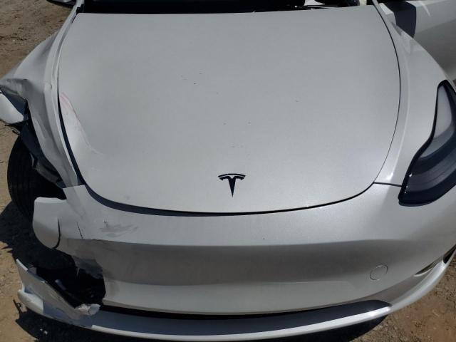 2023 Tesla Model Y VIN: 7SAYGAEE1PF597196 Lot: 56284534