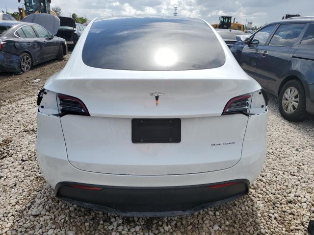 2023 Tesla Model Y VIN: 7SAYGDEE9PA098869 Lot: 58514154