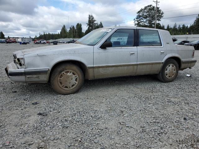 1989 Dodge Dynasty VIN: 1B3BC4635KD561476 Lot: 60512604