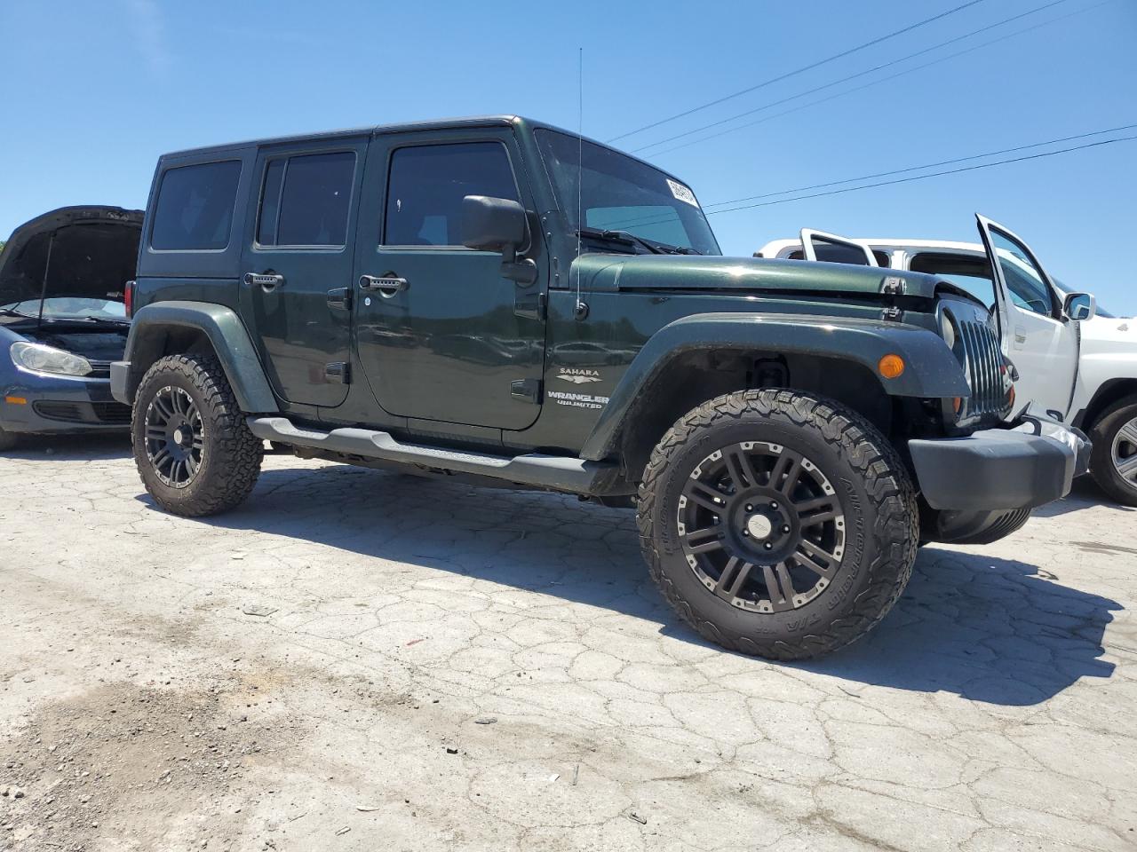 1J4BA5H19BL632233 2011 Jeep Wrangler Unlimited Sahara