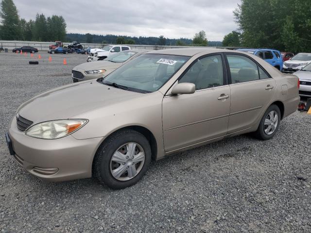 TOYOTA CAMRY LE 2002 tan  gas JTDBE32K520033590 photo #1