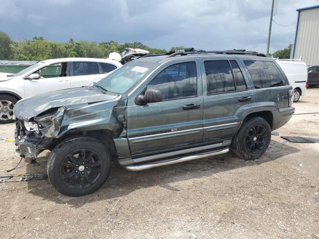 VIN: 1J8GX68J14C167412 Auction: COPART Lot: 59808063 Location: FL - ORLANDO NORTH 1J8GX68J14C167412 JEEP CHEROKEE 2004 GREEN Photo 1