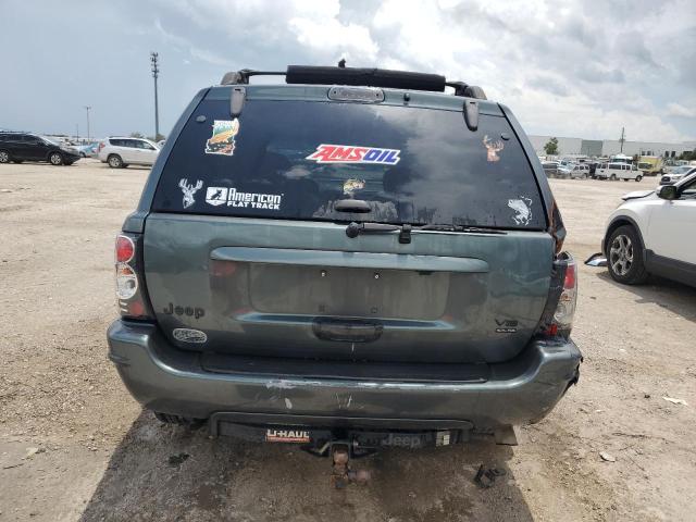 VIN: 1J8GX68J14C167412 Auction: COPART Lot: 59808063 Location: FL - ORLANDO NORTH 1J8GX68J14C167412 JEEP CHEROKEE 2004 GREEN Photo 6