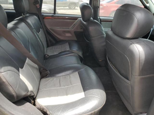 VIN: 1J8GX68J14C167412 Auction: COPART Lot: 59808063 Location: FL - ORLANDO NORTH 1J8GX68J14C167412 JEEP CHEROKEE 2004 GREEN Photo 11