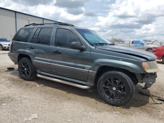 VIN: 1J8GX68J14C167412 Auction: COPART Lot: 59808063 Location: FL - ORLANDO NORTH 1J8GX68J14C167412 JEEP CHEROKEE 2004 GREEN Photo 4