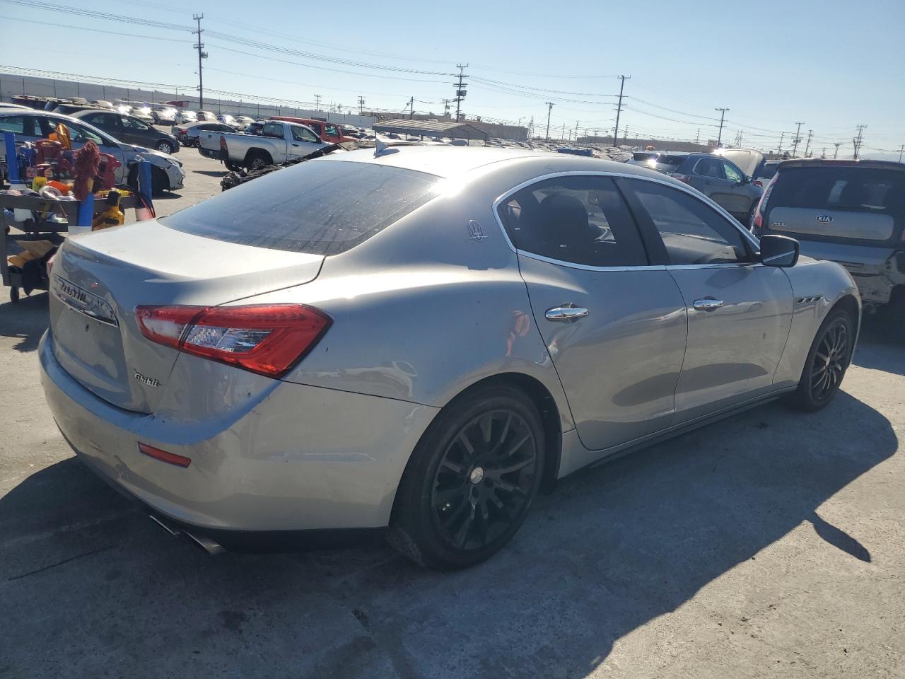 2014 Maserati Ghibli vin: ZAM57XSA9E1089418