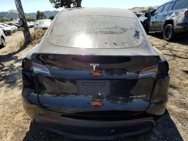 2023 Tesla Model Y VIN: 7SAYGAEE2PF631212 Lot: 63080254