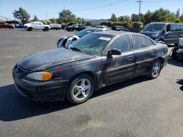 PONTIAC GRAND AM G 2000 black sedan 4d gas 1G2NW52E3YC553038 photo #1