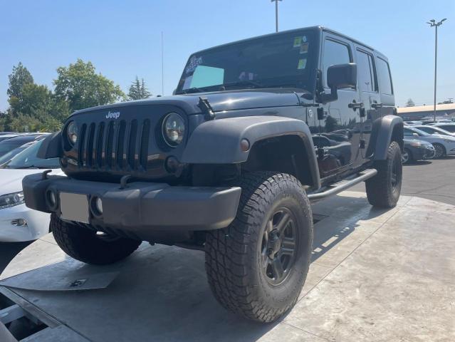 1C4BJWDG6EL325712 2014 Jeep Wrangler Unlimited Sport