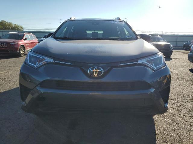 VIN JTMBFREV9JD251321 2018 Toyota RAV4, LE no.5