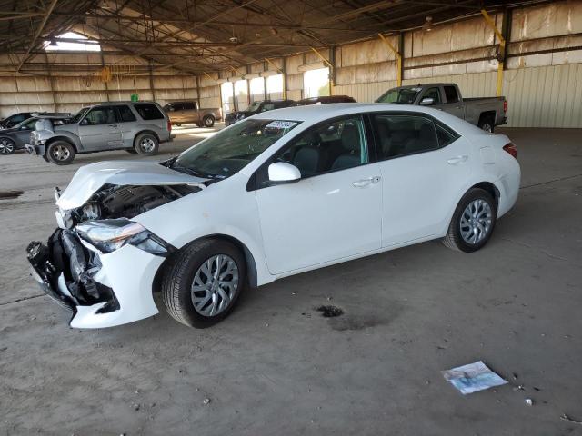 VIN 5YFBURHE3JP803040 2018 Toyota Corolla, L no.1