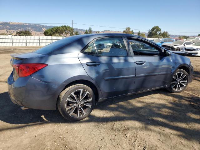 VIN 5YFBURHE7HP574002 2017 Toyota Corolla, L no.3