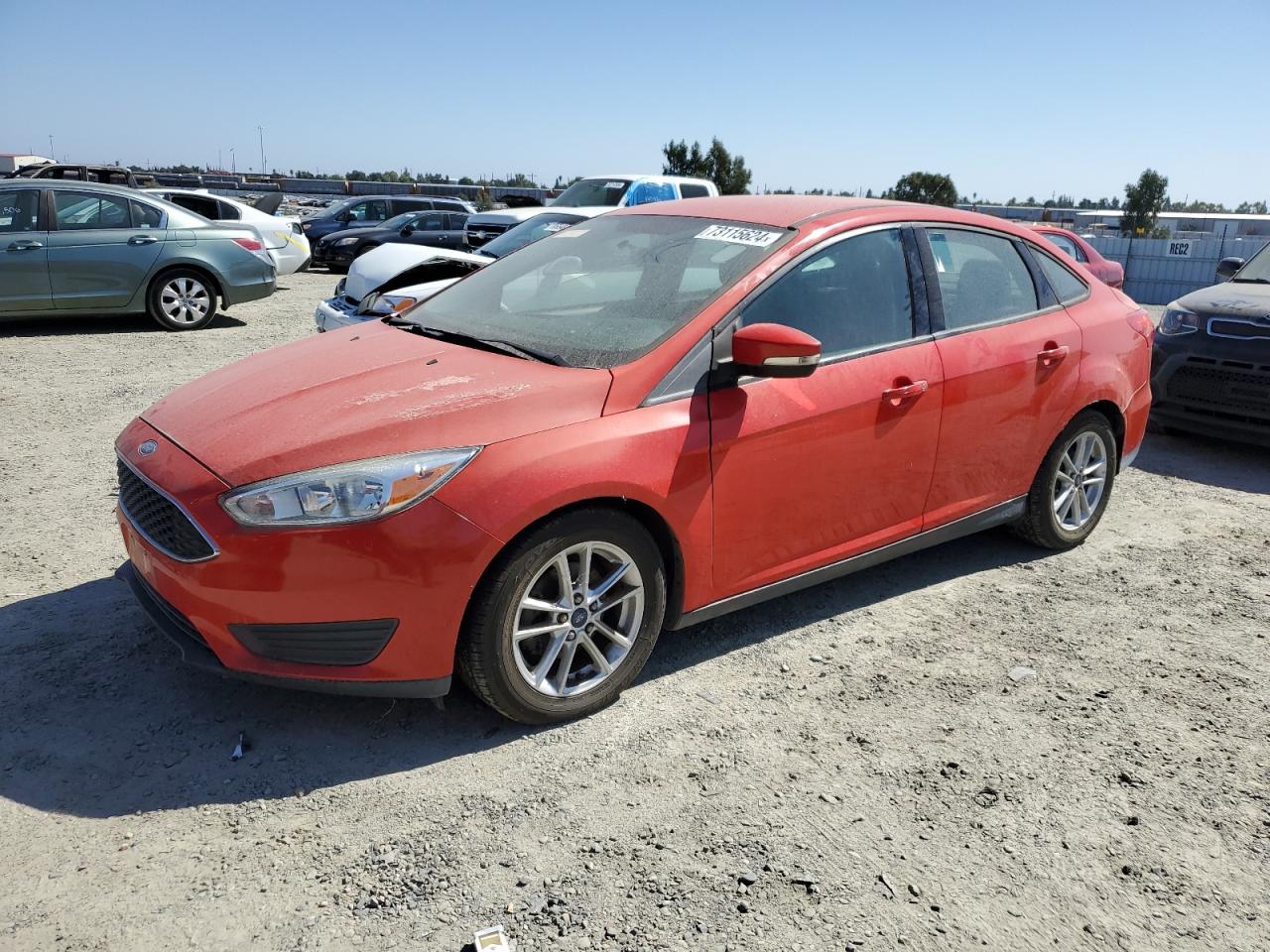 FORD FOCUS SE 2015 red sedan 4d gas 1FADP3F25FL282978 photo #1