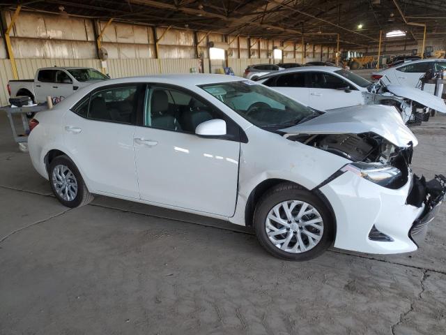 VIN 5YFBURHE3JP803040 2018 Toyota Corolla, L no.4