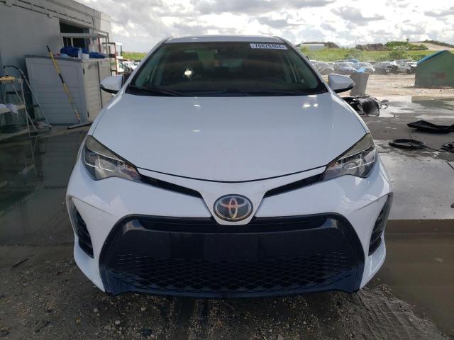 VIN 5YFBURHE4JP797104 2018 Toyota Corolla, L no.5