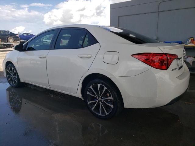 VIN 5YFBURHE4JP797104 2018 Toyota Corolla, L no.2