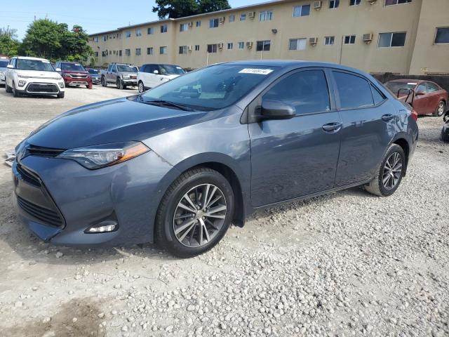 VIN 5YFBURHE4JP757041 2018 Toyota Corolla, L no.1