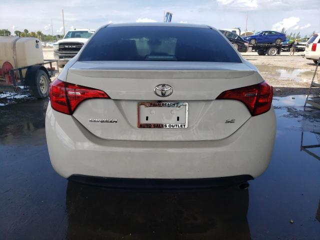 VIN 5YFBURHE4JP797104 2018 Toyota Corolla, L no.6