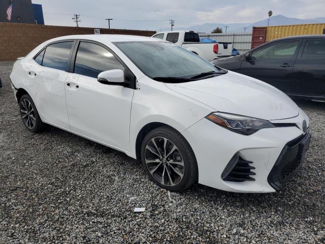 VIN 5YFBURHE7JP801386 2018 Toyota Corolla, L no.4