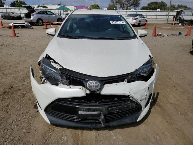 VIN 5YFBURHE4JP838251 2018 Toyota Corolla, L no.5