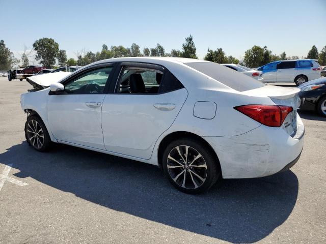 VIN 5YFBURHE2JP789664 2018 Toyota Corolla, L no.2