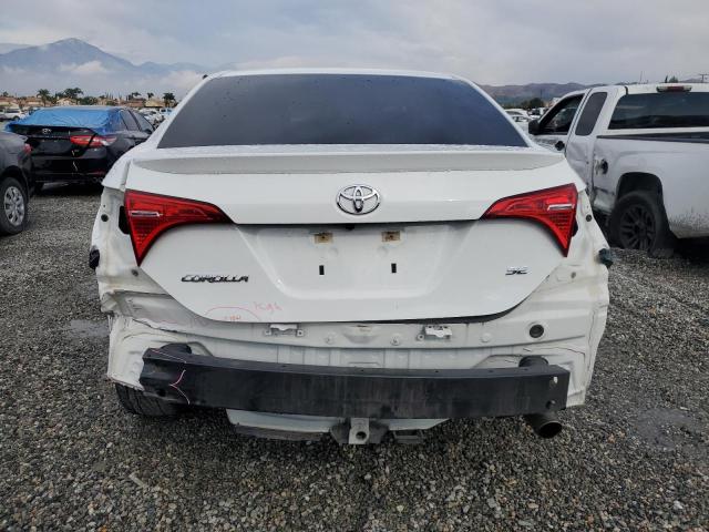 VIN 5YFBURHE7JP801386 2018 Toyota Corolla, L no.6