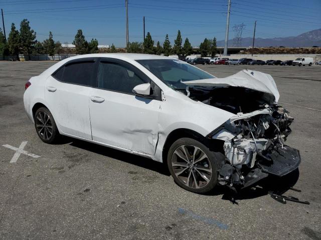 VIN 5YFBURHE2JP789664 2018 Toyota Corolla, L no.4