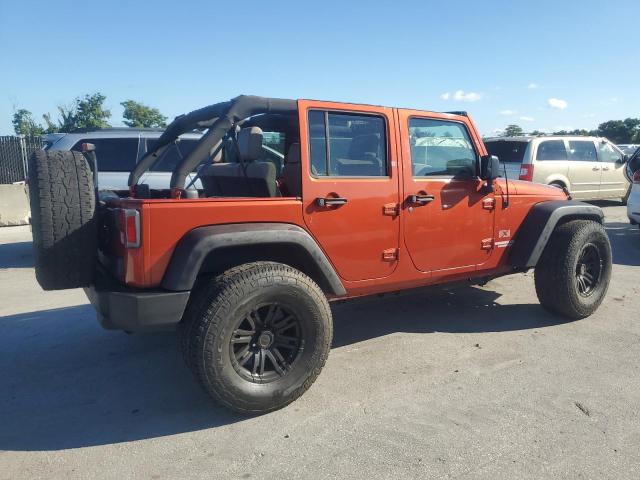 JEEP WRANGLER U 2009 orange  gas 1J4GB39189L749494 photo #4