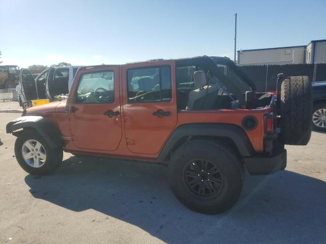 JEEP WRANGLER U 2009 orange  gas 1J4GB39189L749494 photo #3