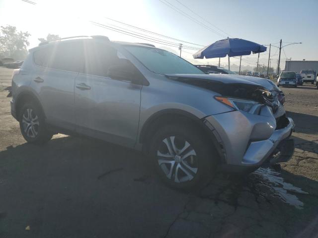 VIN JTMZFREV8JJ167586 2018 Toyota RAV4, LE no.4