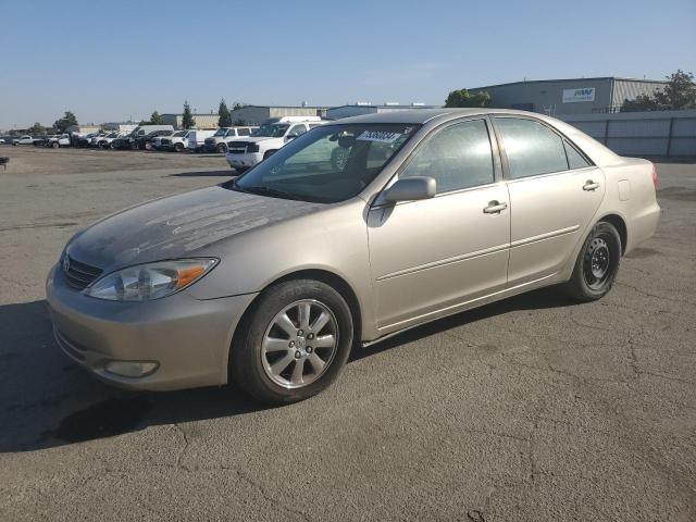 TOYOTA CAMRY LE 2003 gold sedan 4d gas JTDBE32K430155066 photo #1