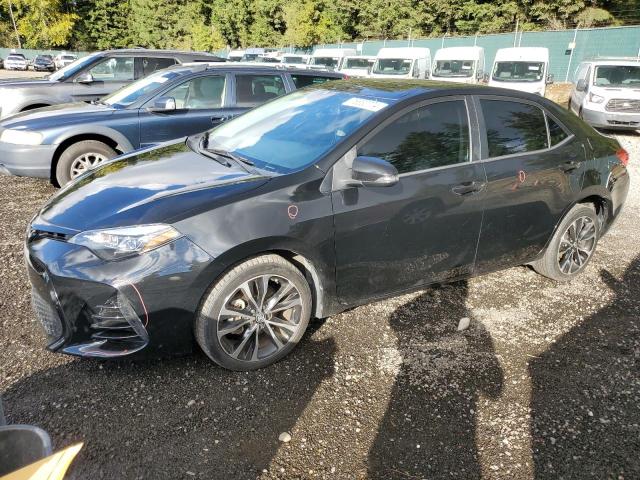 VIN 5YFBURHE5JP823449 2018 Toyota Corolla, L no.1