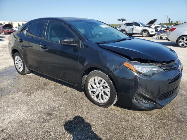 VIN 5YFBURHE2JP769219 2018 Toyota Corolla, L no.4