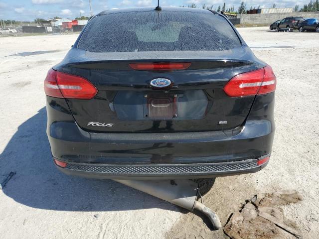 VIN 1FADP3F2XJL256420 2018 Ford Focus, SE no.6