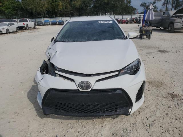 VIN 5YFBURHE8JP774716 2018 Toyota Corolla, L no.5